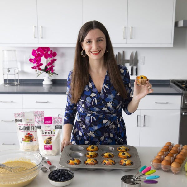 Maya with muffins made with almond flour.